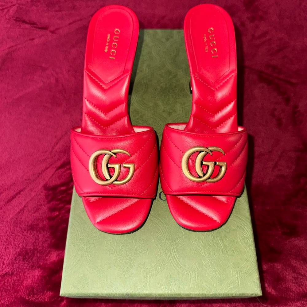 Women’s red Gucci slide in heels.